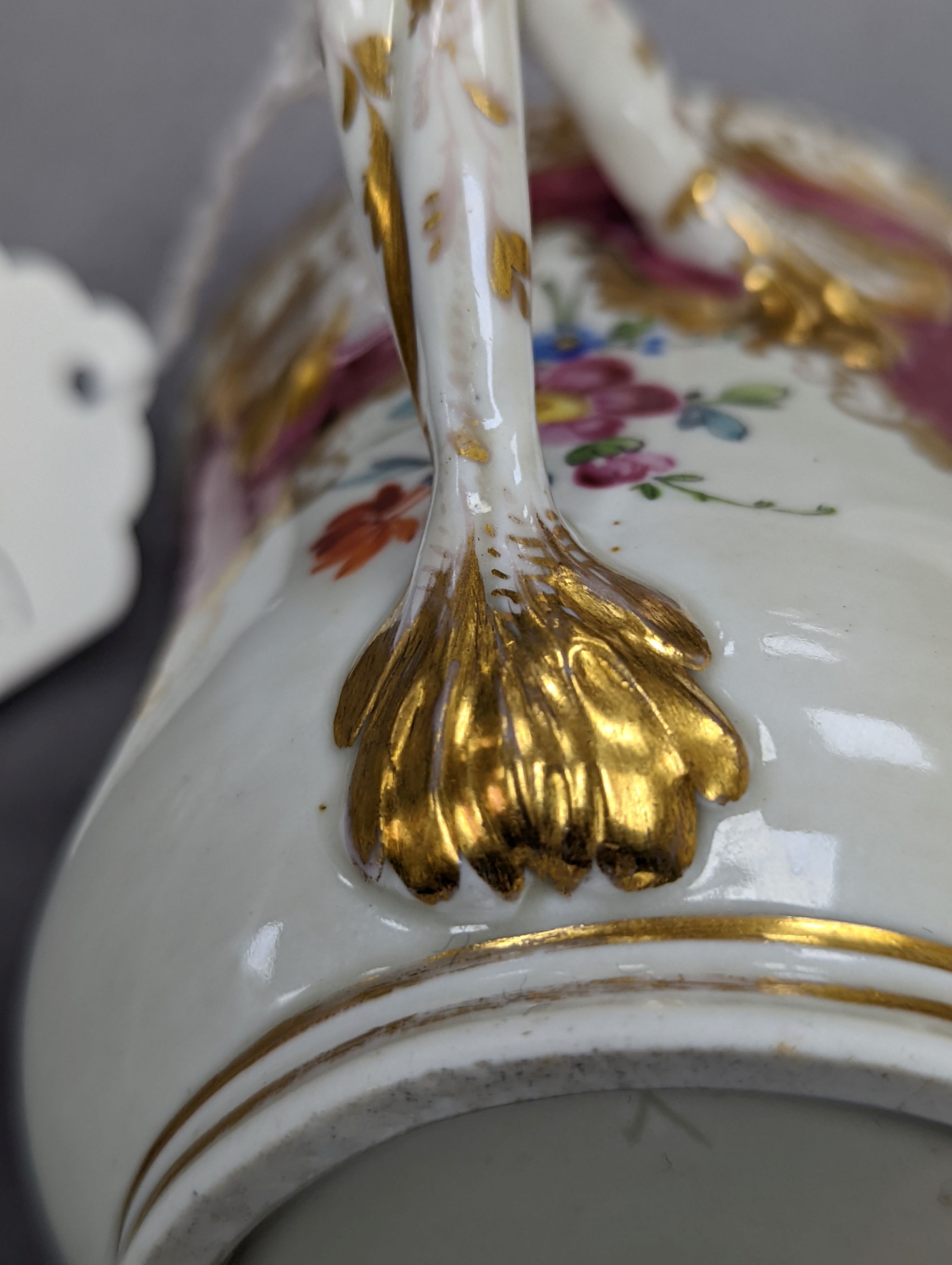 An 18th century Mennecy porcelain cup and cover, a Meissen style cup and cover, an English porcelain floral encrusted double inkwell and cover and a similar jar and cover